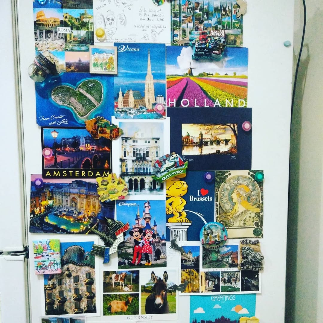 Travel vision board on the side of a fridge