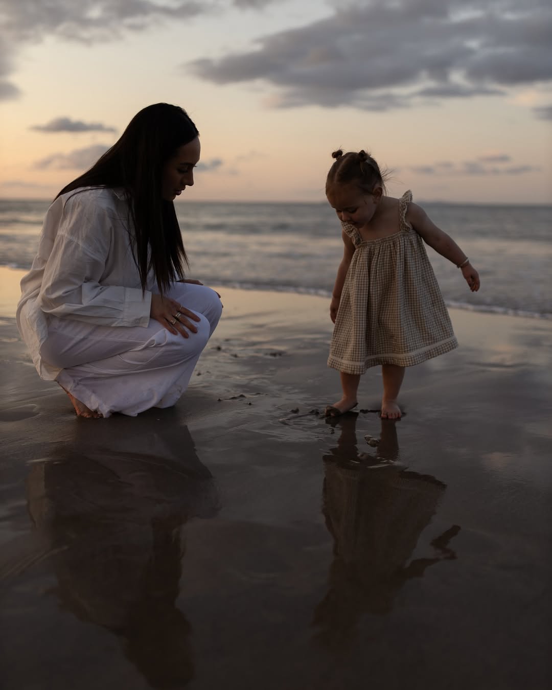 Mom and daughter having beach time
