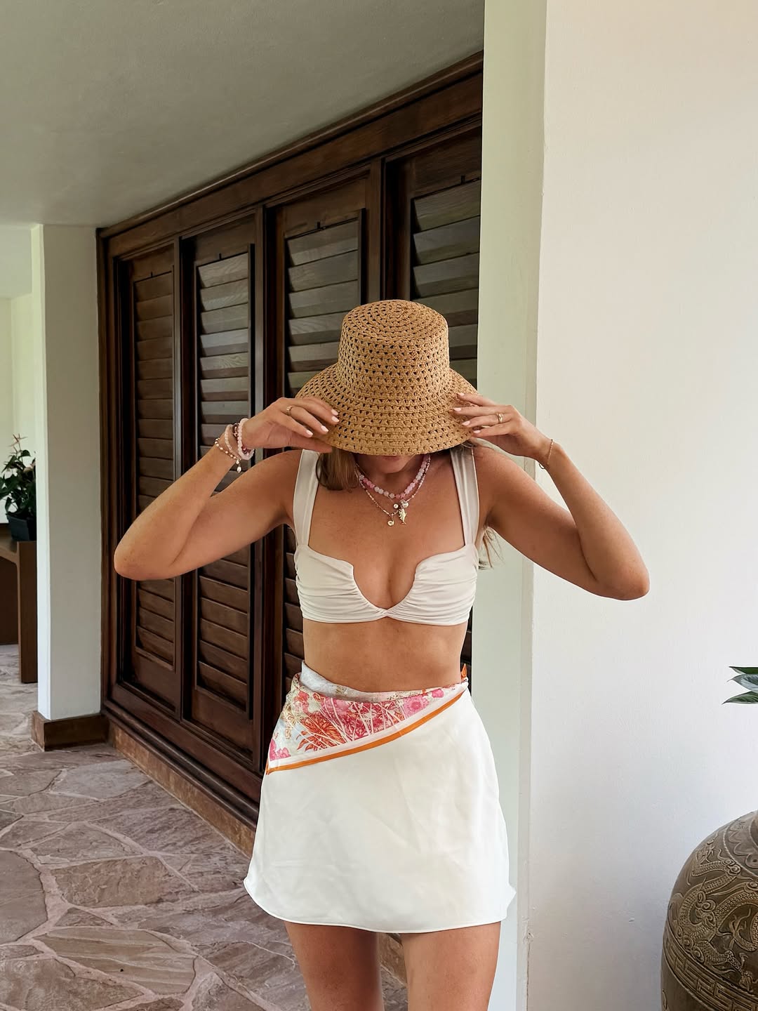 Crop top with mini skirt and wide brim hat for sunny days